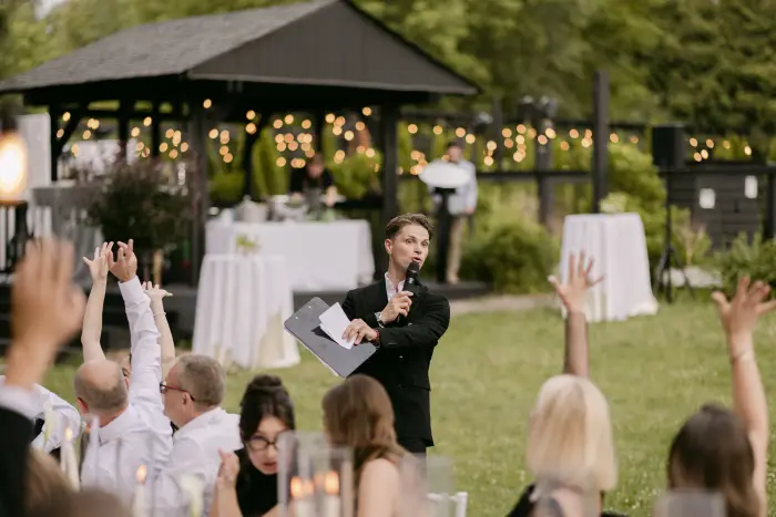Guests with their hands up