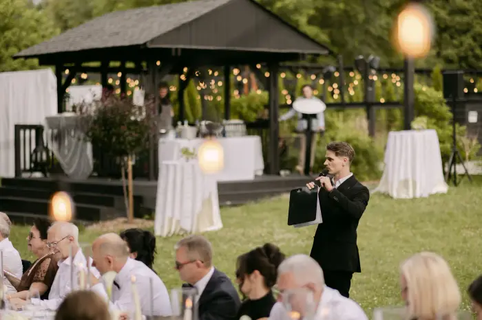 Hosting the outdoor reception, guests seated