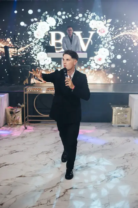 Hosting in front of the sparkle wall