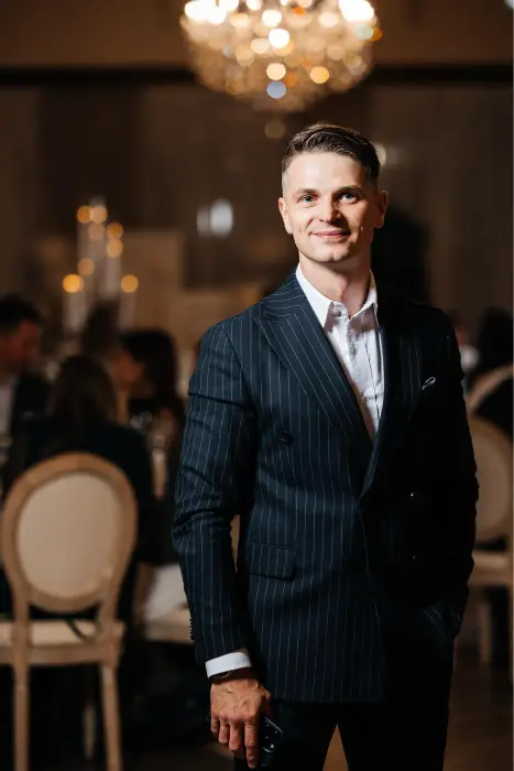 Portrait of Vladyslav Katsalap in a pinstripe suit