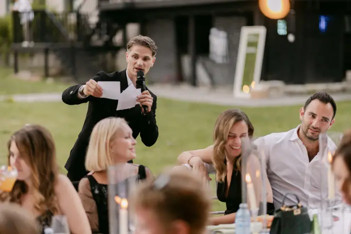 Reading a card to the guests