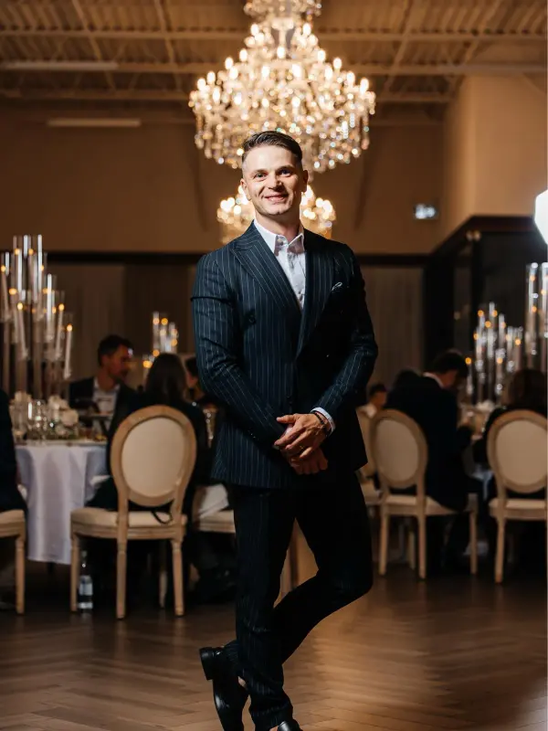 Vladyslav hosting a formal ballroom dinner