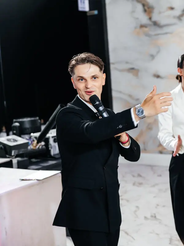 Vladyslav running a game with three guests